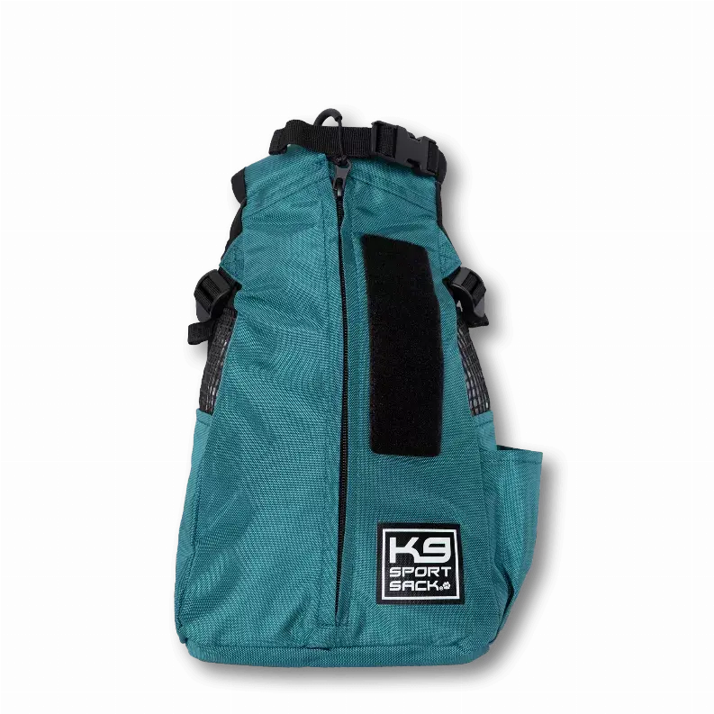Teal K9 Sport Sack dog backpack, made from durable nylon, featuring adjustable straps and a large front pocket.