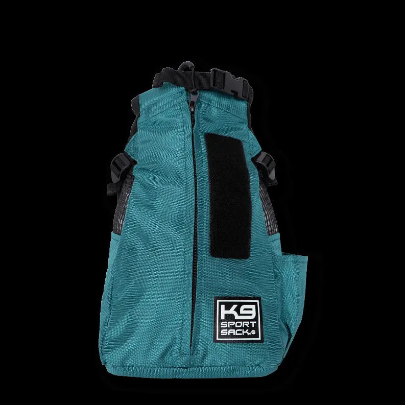 Teal mesh dog carrier backpack with adjustable straps and zipper pocket, featuring a K9 Sportsack logo.