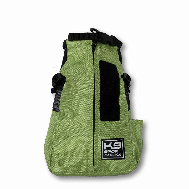 Green K9 Sport Sack, durable fabric, zippered closure, ideal for carrying pets on outdoor adventures.