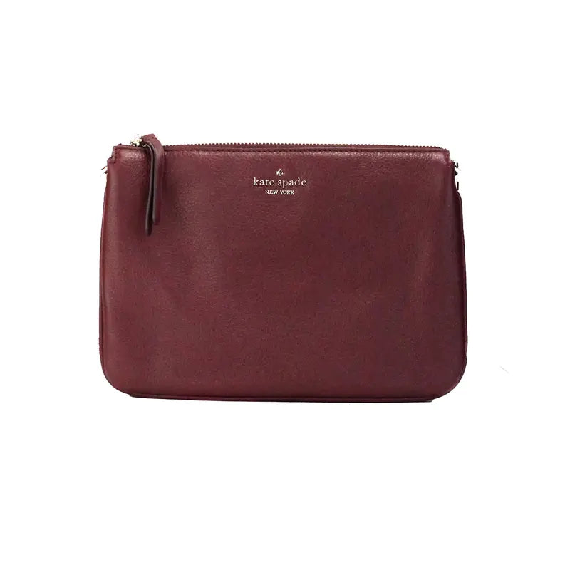 Kate Spade maroon leather pouch bag with gold-tone logo and zip closure, perfect for stylish organization.
