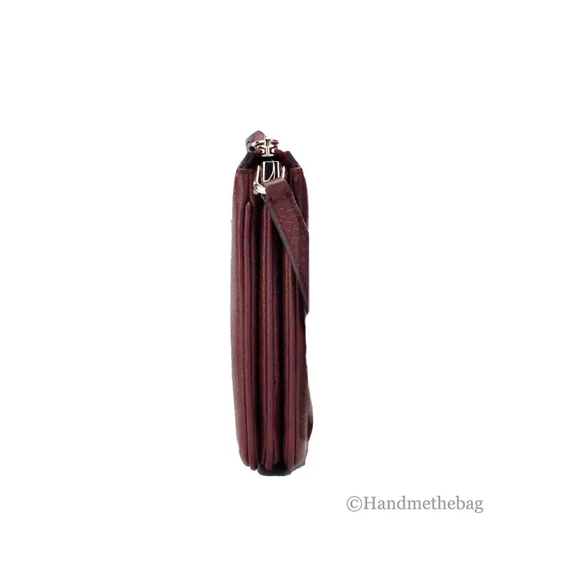 Burgundy pleated clutch handbag with a silver clasp, elegant and stylish for special occasions.
