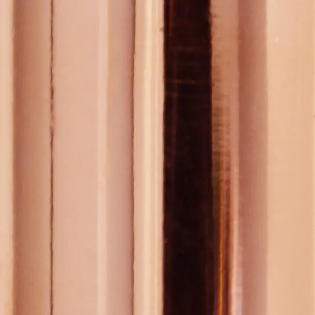 Close-up of a glossy rose gold metal surface with vertical stripes, perfect for modern decor or stylish accessories.