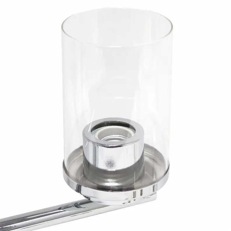 Clear glass candle holder with chrome base, modern design, perfect for adding elegance to any decor.