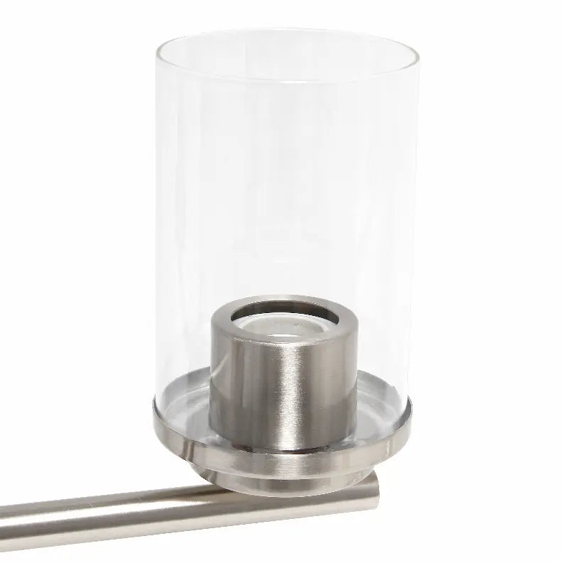 Modern stainless steel candle holder with clear glass cylinder, perfect for creating a sleek, contemporary ambiance.