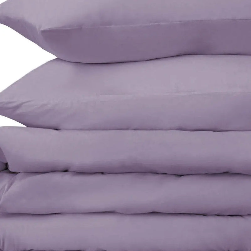 Soft lavender cotton pillowcases, smooth finish, set of four, perfect for a cozy bedroom aesthetic.