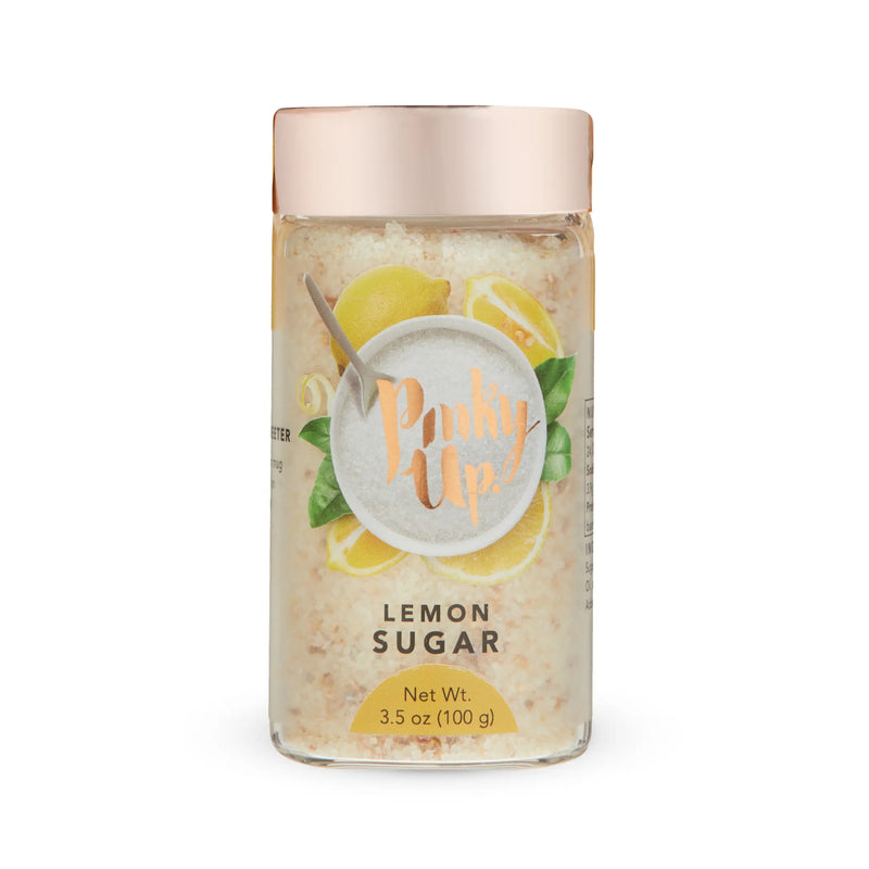 Pinky Up Lemon Sugar in a clear jar with a rose gold lid, featuring lemon and leaf accents, 3.5 oz (100 g).