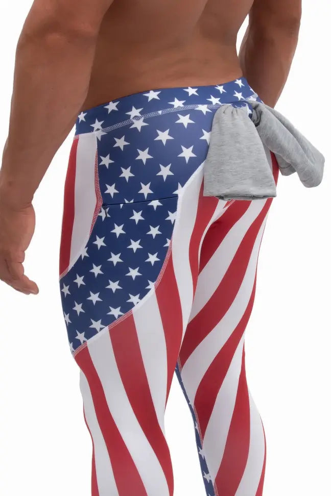 Men's patriotic leggings featuring red and white stripes, blue with white stars, and a grey waistband accessory.