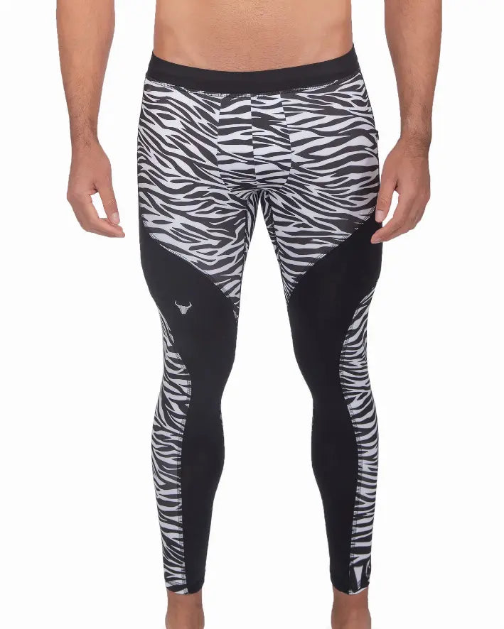 Men's black and white zebra print leggings, made from stretchy fabric, ideal for workouts and activewear.