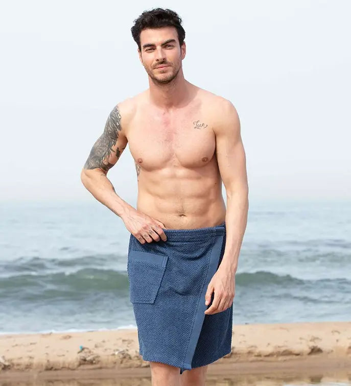 Navy blue cotton terry cloth beach towel wrap for men, featuring a side pocket and stylish, casual design.