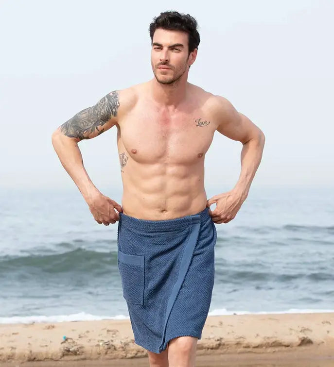 Blue cotton beach towel wrap for men, featuring a front pocket, perfect for summer outings and beach days.