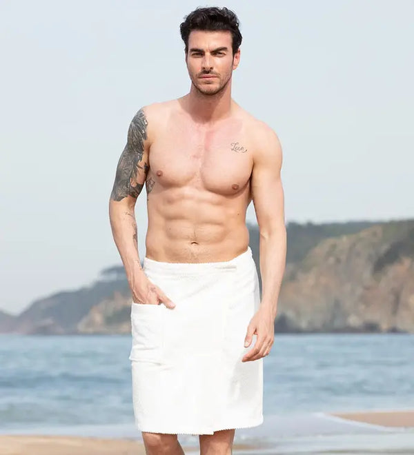 Men's white cotton beach towel wrap with pockets, perfect for summer outings by the water.