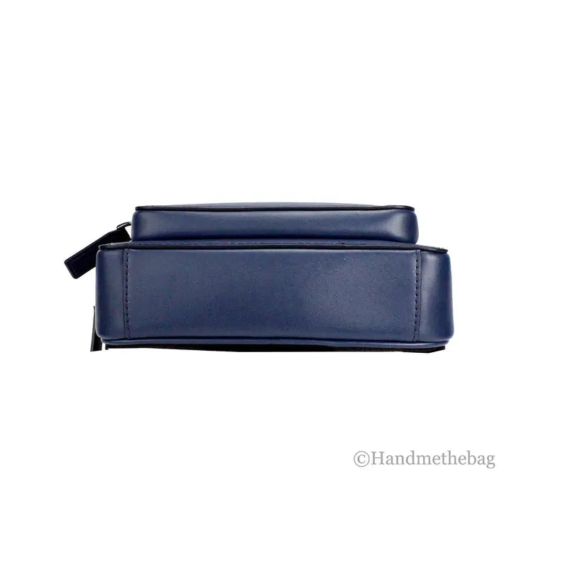 Navy blue leather cosmetic bag with a sleek design and sturdy zip closure, ideal for travel and everyday use.