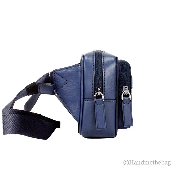 Navy blue leather crossbody bag with dual zip pockets and adjustable strap, sleek and stylish for everyday use.