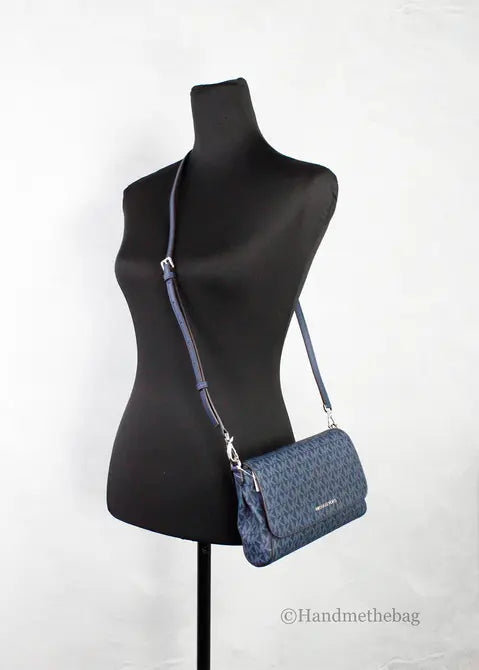 Navy blue patterned crossbody bag with adjustable strap, sleek design, perfect for casual outings.