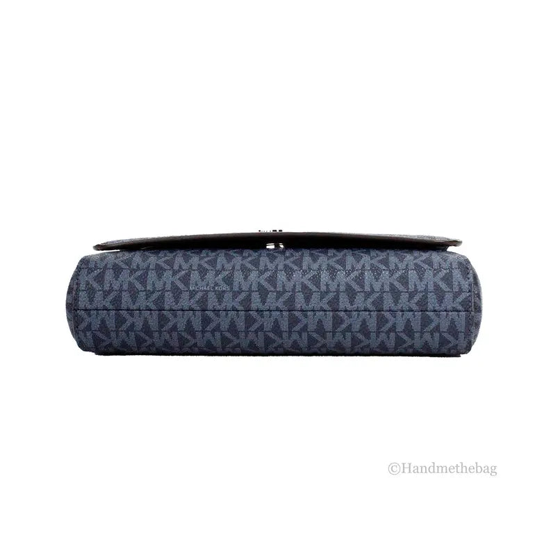 Navy blue monogrammed canvas clutch bag with sleek design and magnetic closure. Versatile accessory for any occasion.