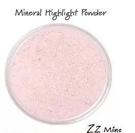 Pink mineral highlight powder in a translucent jar, perfect for a luminous glow. Ideal for all skin tones.