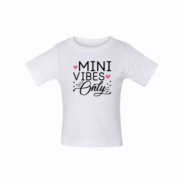White toddler t-shirt featuring "Mini Vibes Only" in black and pink text, perfect for casual play.