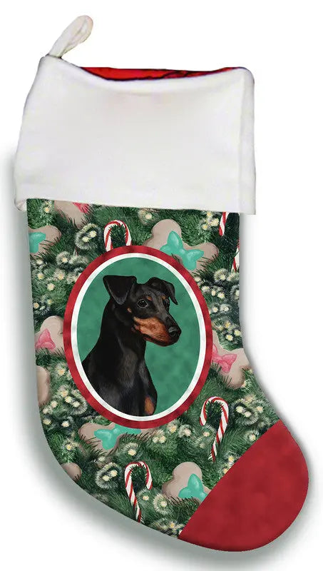 Red and white dog Christmas stocking featuring a Doberman portrait, decorated with candy canes and festive greenery.