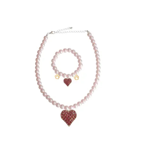 Pink pearl necklace and bracelet set with red heart pendant, featuring gold accents and a romantic style.