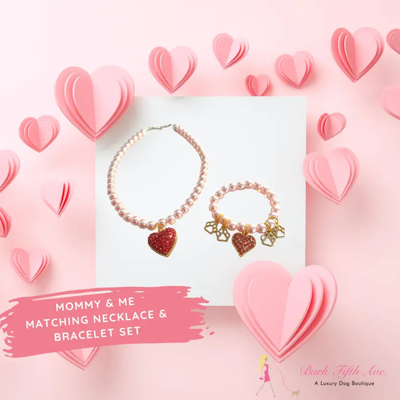 Pink pearl mommy and me matching necklace and bracelet set with heart charms, perfect for stylish bonding moments.