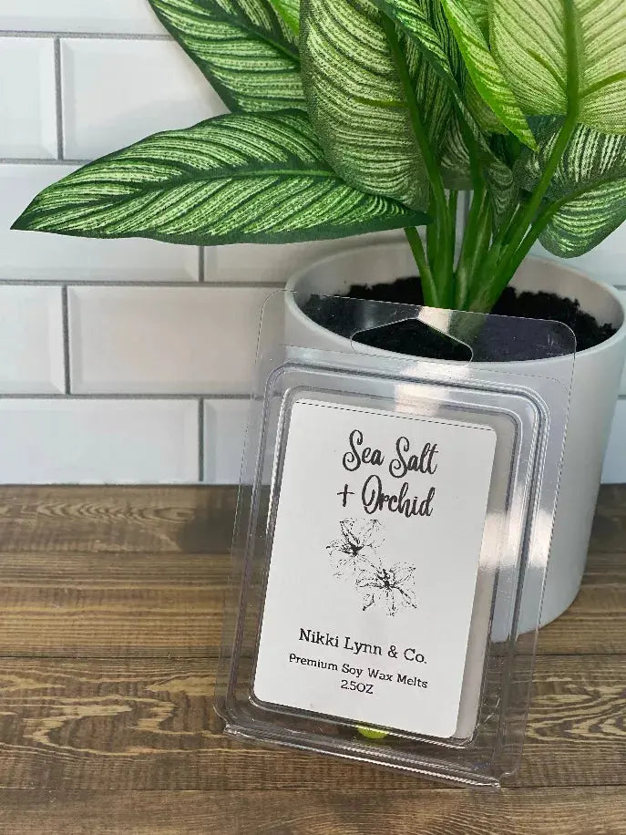 Sea Salt + Orchid premium soy wax melts in clear clamshell packaging, 2.5 oz, stylish label design.