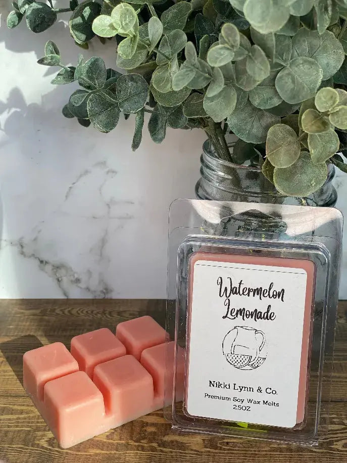 Watermelon Lemonade soy wax melts in soft pink, perfect for fragrant home ambiance. 2.5oz pack by Nikki Lynn & Co.