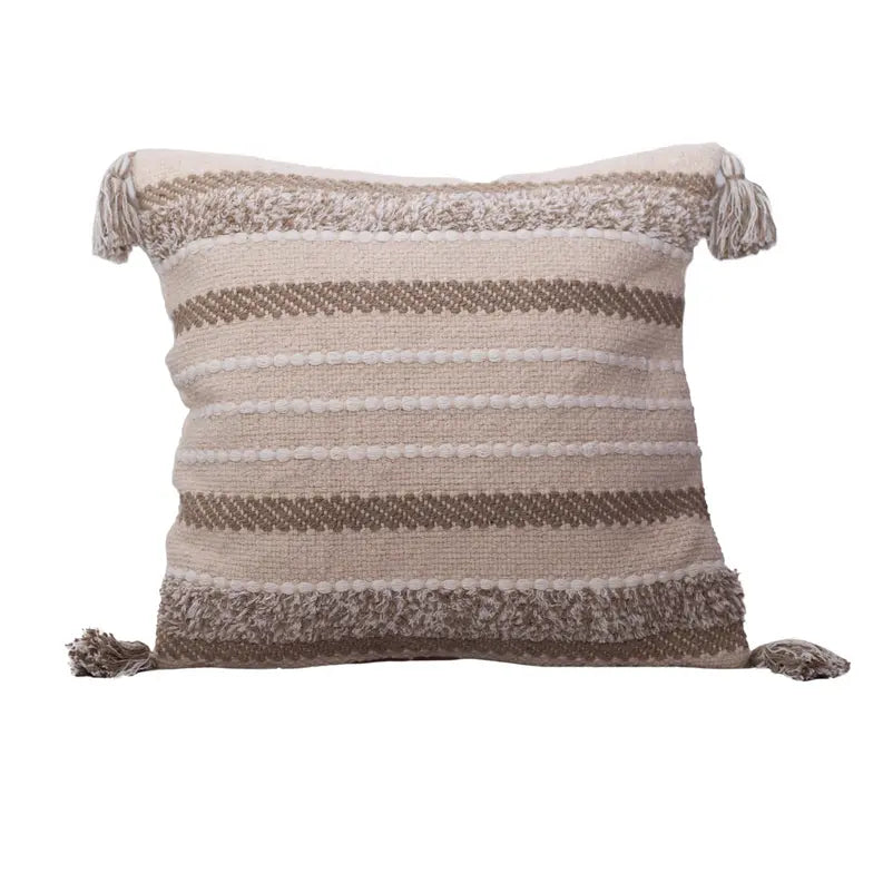 Cream and brown striped decorative pillow with tassels, made from soft, woven cotton for a stylish bohemian accent.