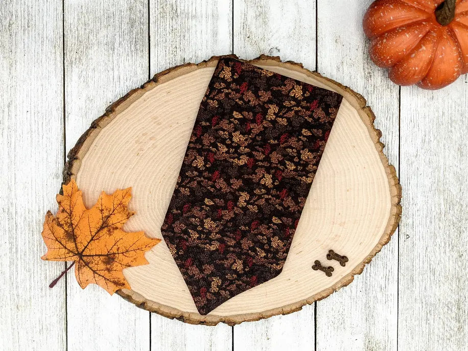 Brown floral necktie with autumn leaves design, made from silk, perfect for fall-themed occasions.