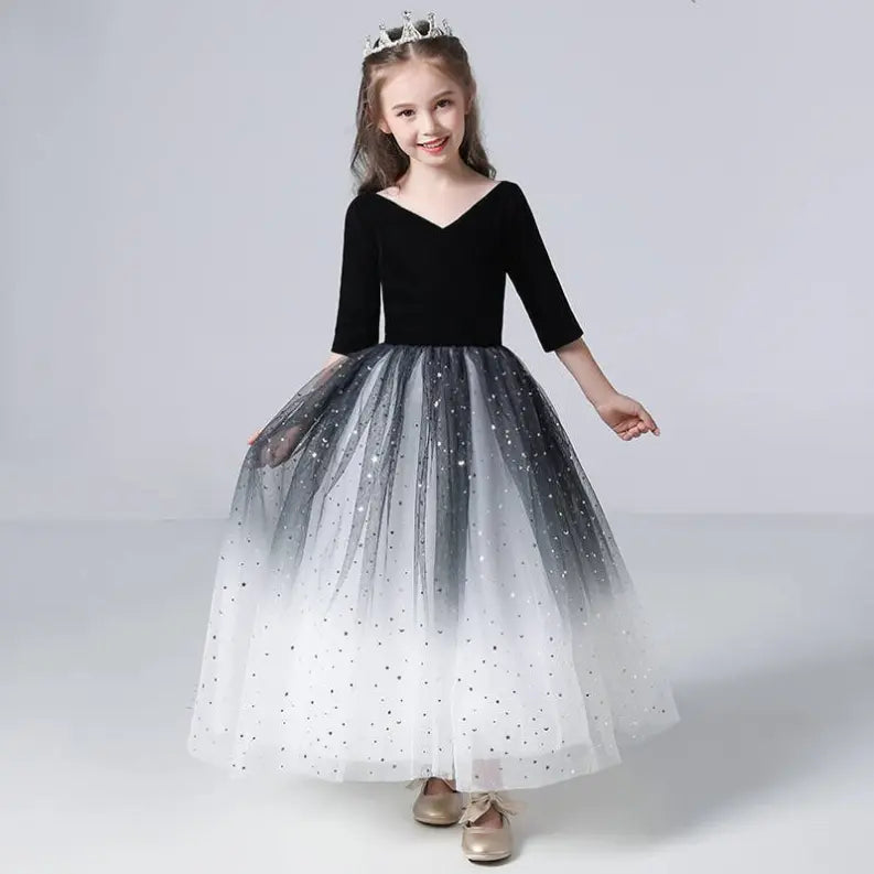 Black and white ombre tulle dress with 3/4 sleeves and sequined skirt, perfect for girls' formal occasions.