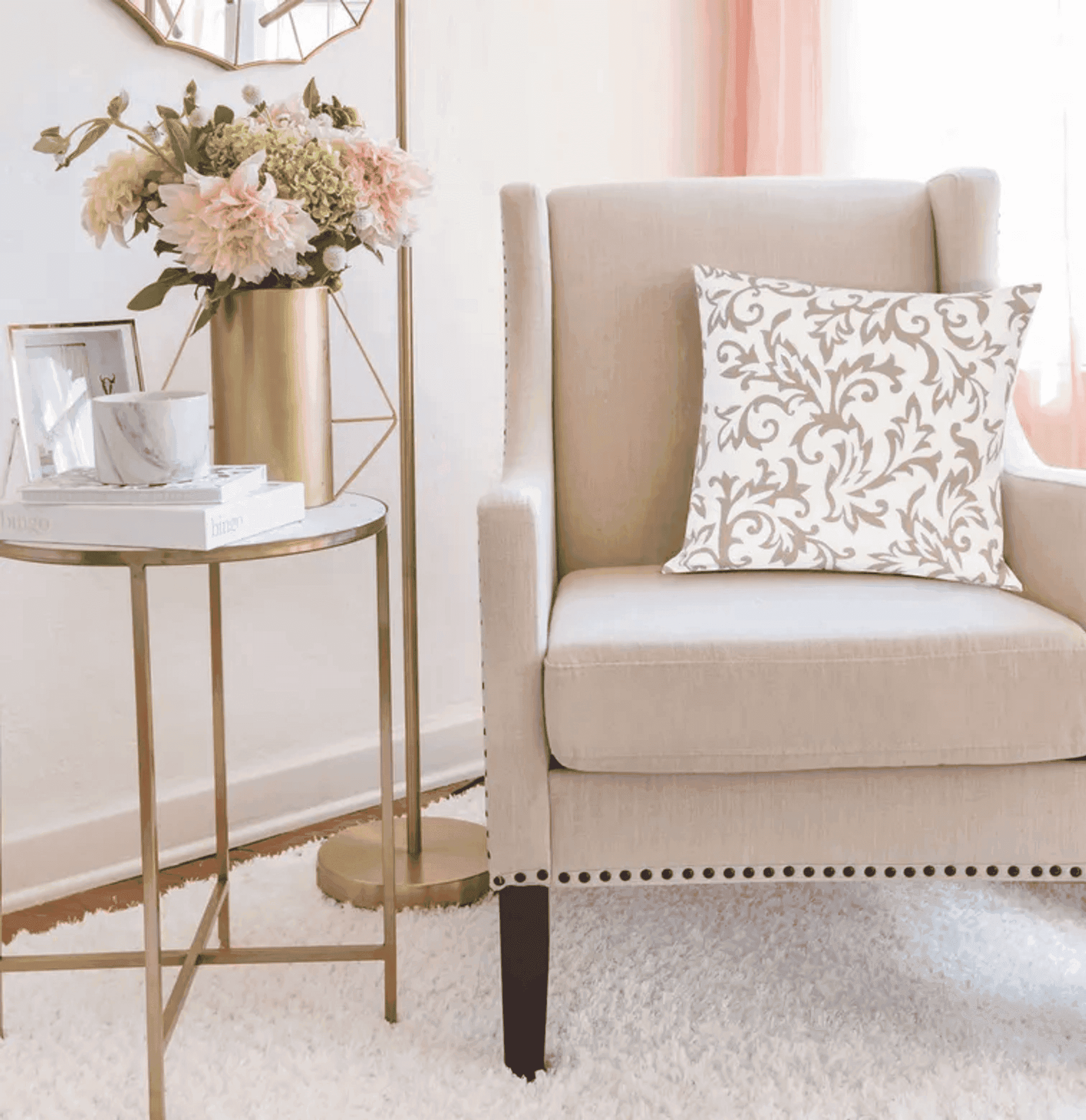 Beige and cream decorative pillow with floral pattern, perfect for an elegant living room chair.