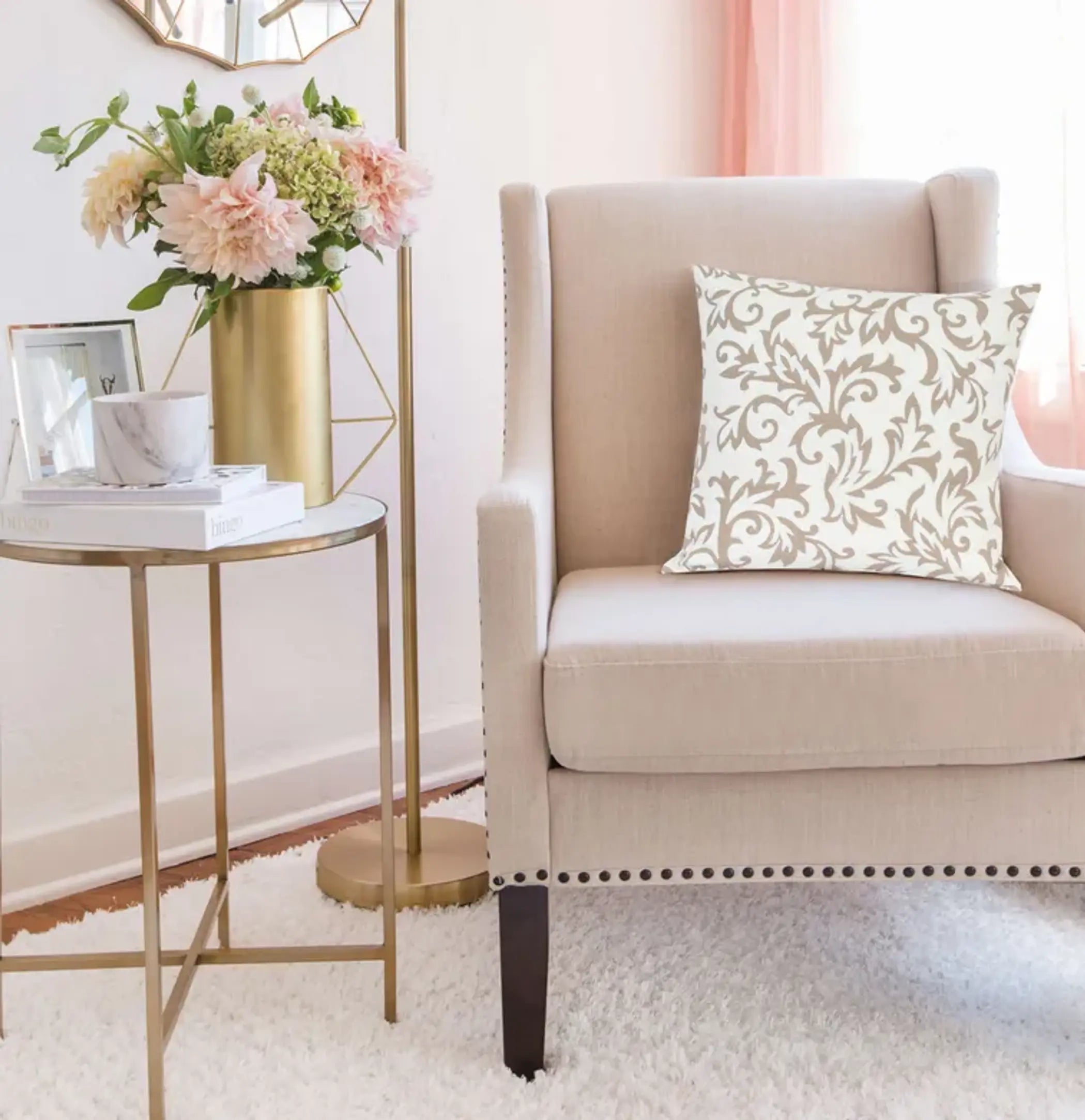 Beige and cream decorative pillow with floral pattern, perfect for an elegant living room chair.