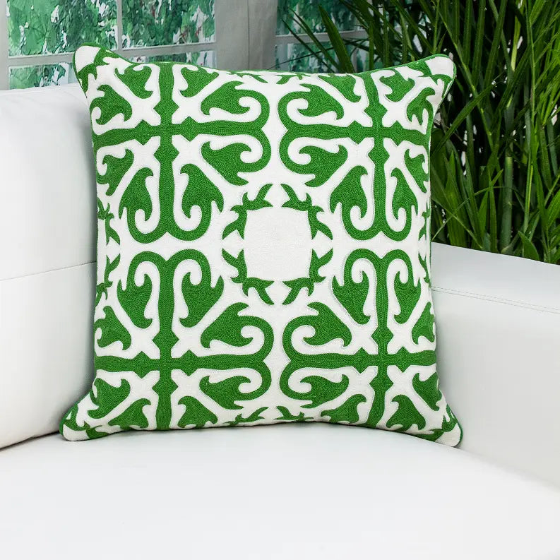 Green and white decorative throw pillow with a geometric pattern, made of soft fabric, perfect for stylish home decor.