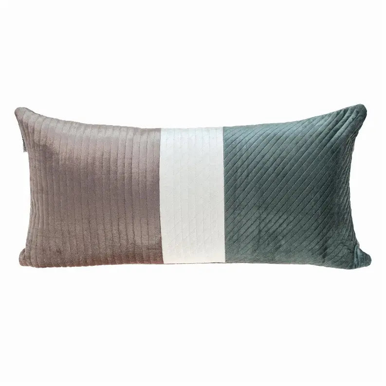 Long rectangular throw pillow in teal, gray, and white velvety fabric with a ribbed texture. Perfect for modern decor.