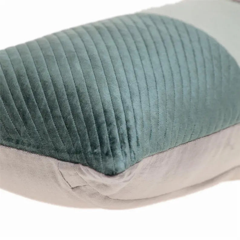 Sage green and gray velvet lumbar pillow with ribbed texture, perfect for modern home decor.