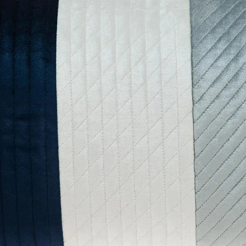 Navy blue, white, and silver striped velvet quilted throw blanket for modern home decor.