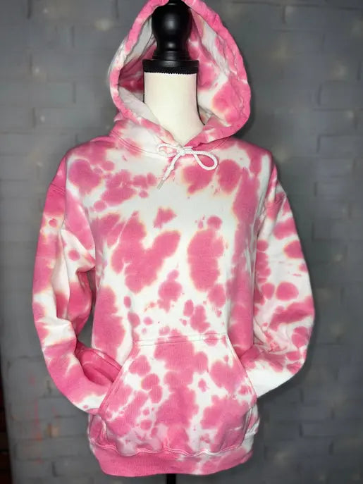 Pink and white tie-dye hoodie made from soft cotton, featuring a drawstring hood and front pocket, perfect for casual wear.