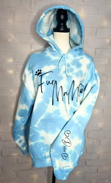 Light blue tie-dye hoodie with "Fur Mama" print, featuring a cozy fleece material and relaxed fit.