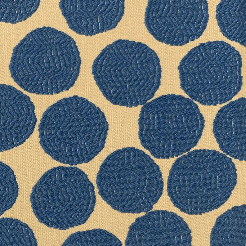 Blue textured circles on beige fabric, perfect for modern upholstery or crafting projects.
