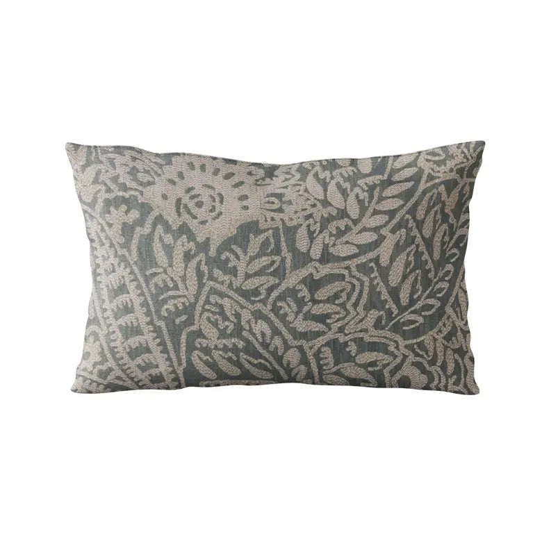 Decorative lumbar pillow with intricate floral pattern in muted blue and beige, made from durable linen blend fabric.