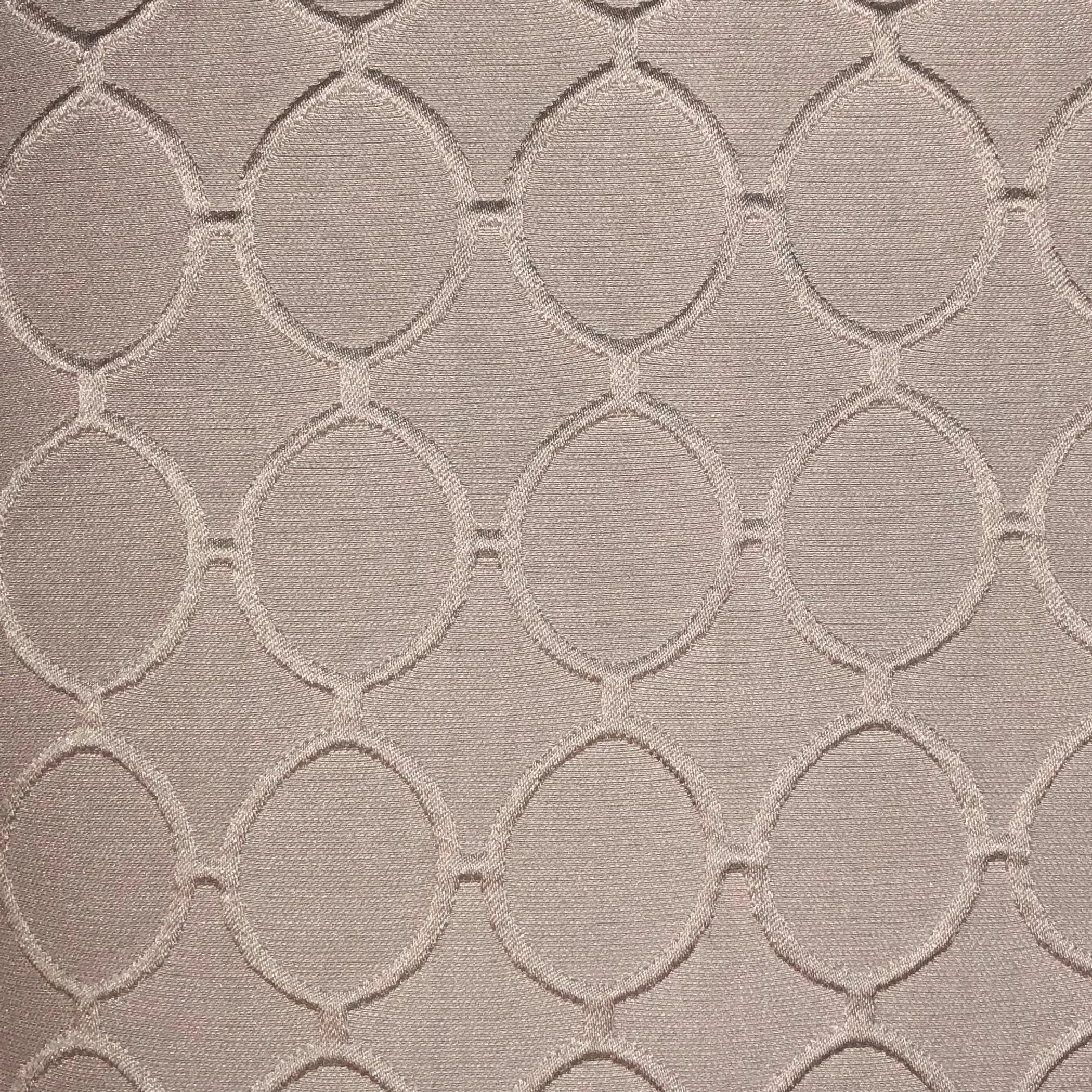Light pink textured fabric with woven circle patterns, perfect for upholstery and home decor.