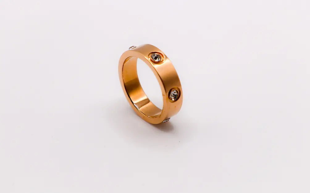 Rose gold stainless steel ring with two sparkling stones, minimalist design, perfect for everyday elegance.
