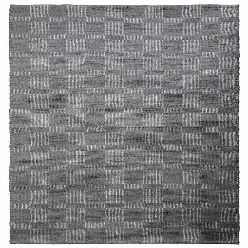 Gray woven checkered area rug, crafted from durable materials, perfect for modern and stylish home decor.