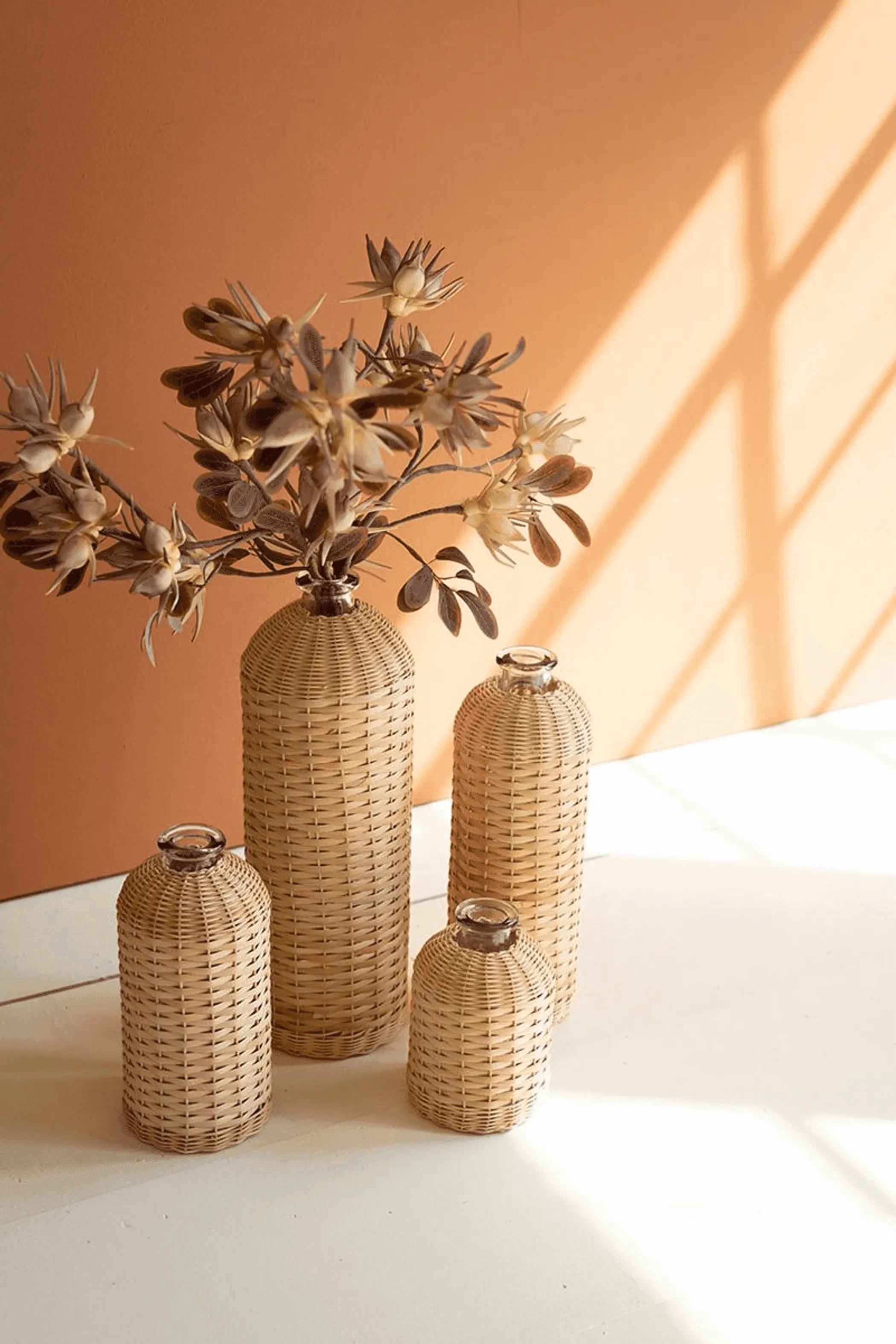 SET OF FOUR RATTAN WRAPPED GLASS VASES Kalalou
