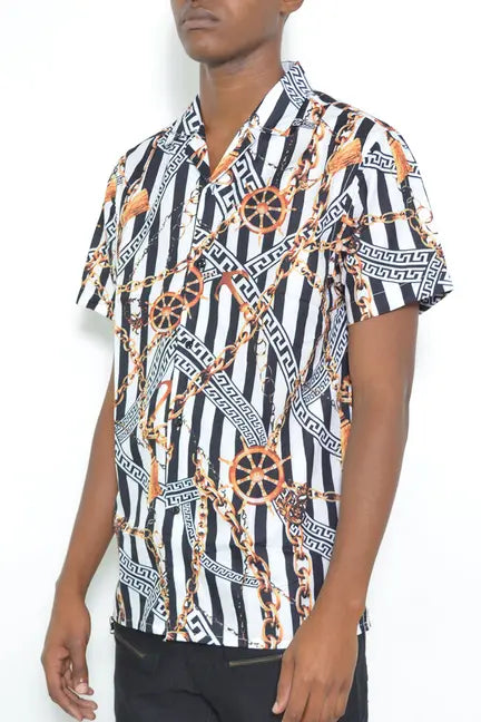 Black and white short-sleeve shirt with gold chain print and Greek key design, perfect for a trendy casual look.