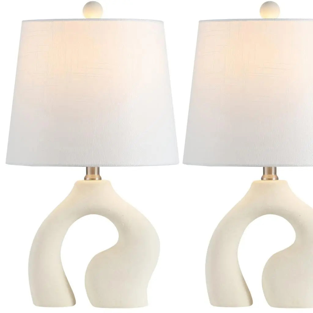 Modern cream ceramic table lamp set with white fabric shades and gold accents, perfect for contemporary decor.