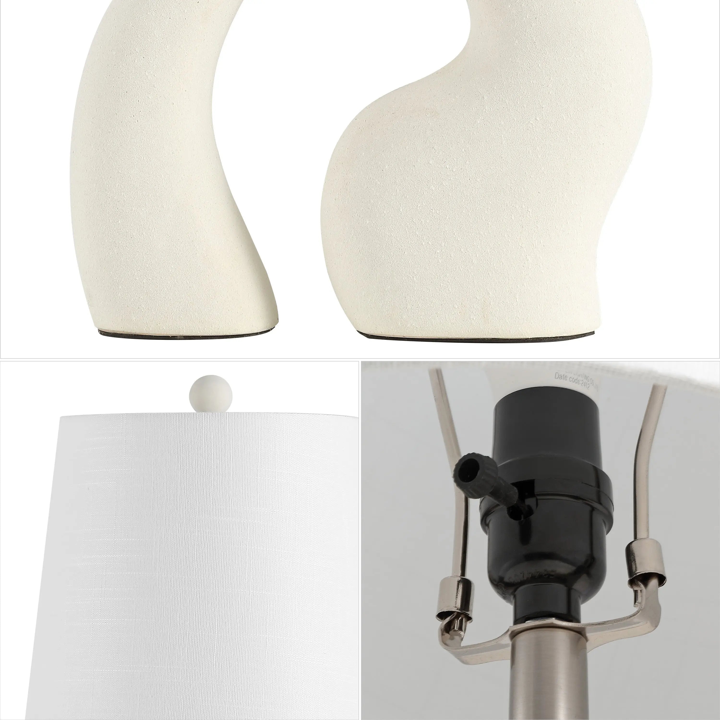 White ceramic abstract table lamp with a textured base, featuring a simple fabric shade and polished metal fittings.