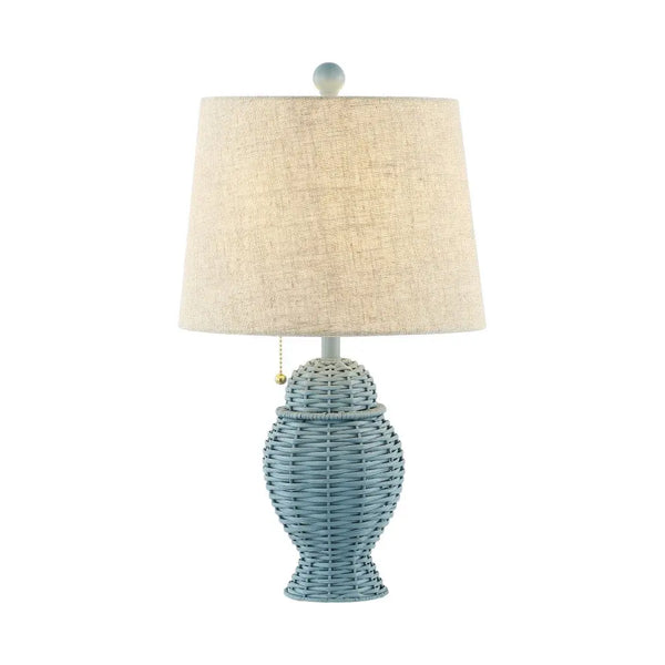 Light blue wicker table lamp with a linen shade and pull chain, perfect for coastal or modern decor.