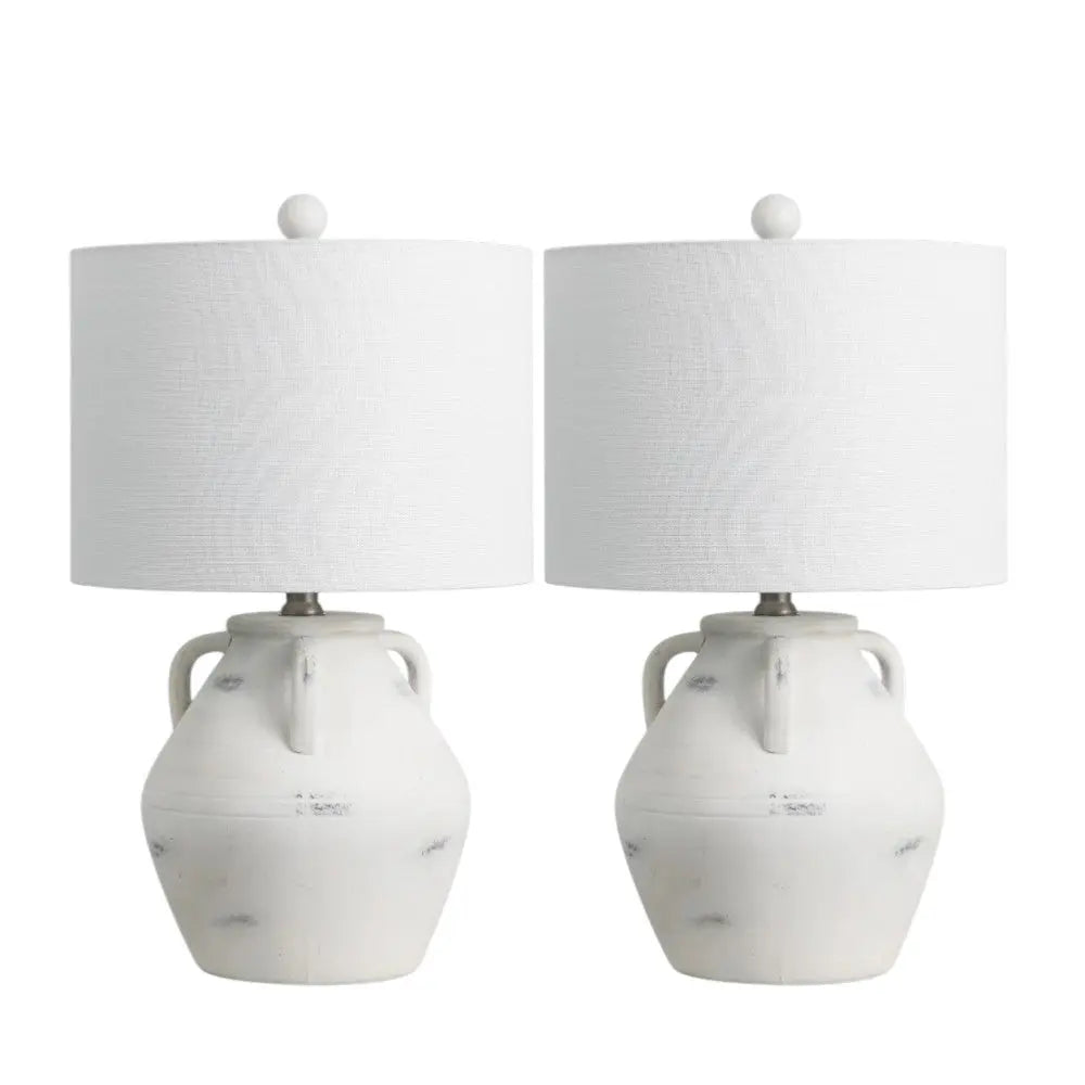 Set of 2 white ceramic table lamps with textured fabric shades and unique jug-shaped bases, perfect for modern decor.