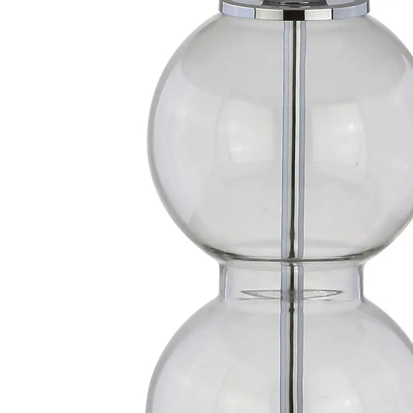 Clear glass decorative vase with a sleek silver metal accent, modern design, perfect for home decor.