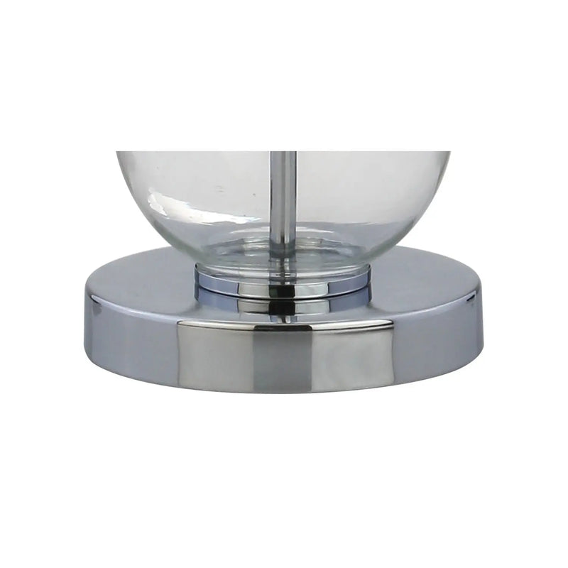 Sleek chrome base glass lamp with a minimalist design, perfect for modern home decor.